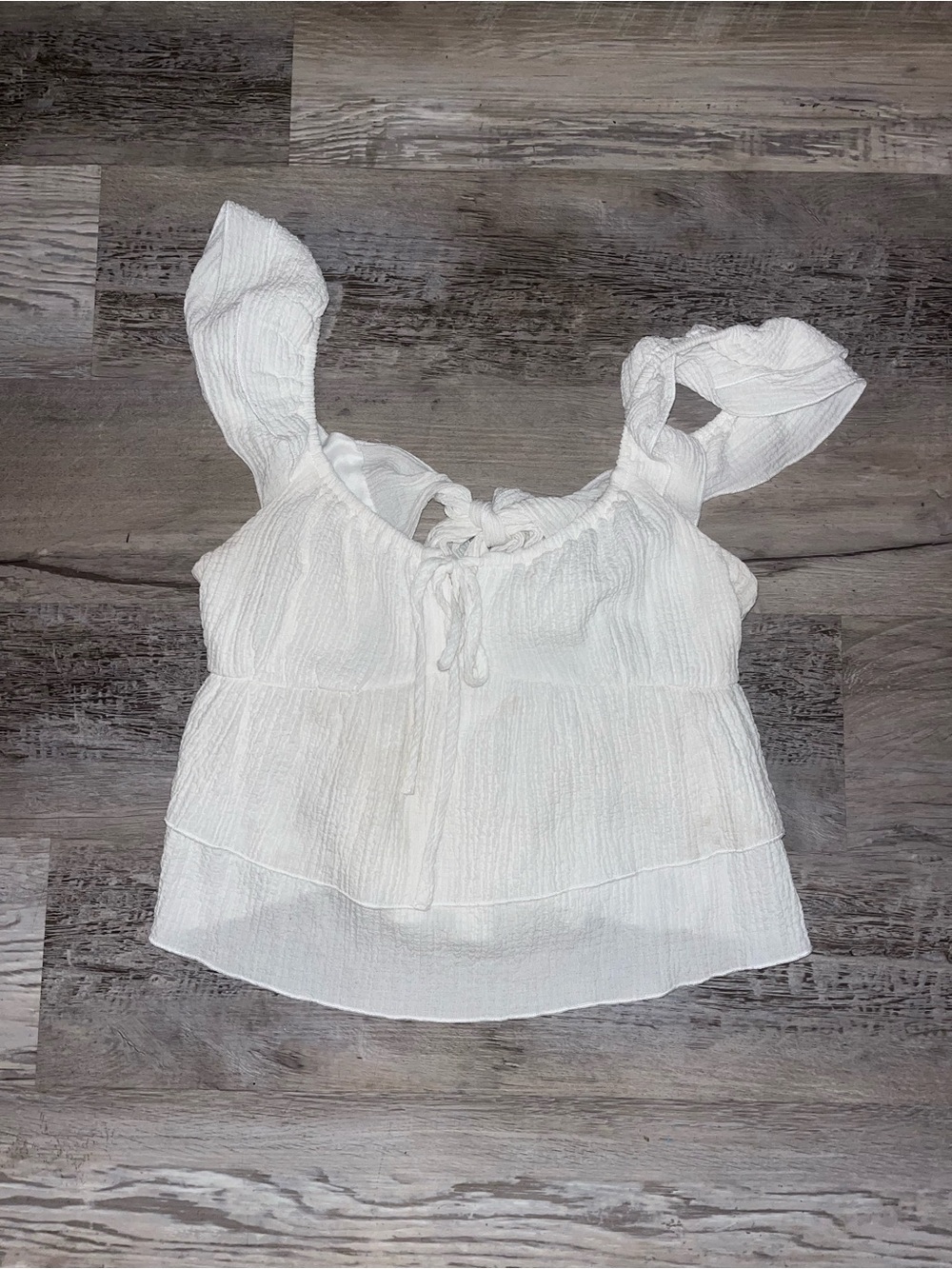 white ruffle tie front back top